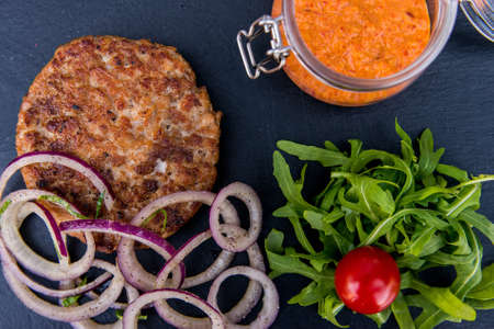 Grilled steak of chopped beef with vegetables