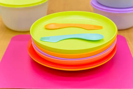 Bright plastic tablewareの写真素材