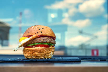 Delicious restaurant hamburger with fried eggの写真素材