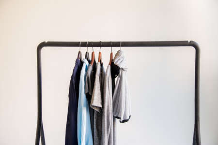 Mobile rack with clothes on white backgroundの写真素材