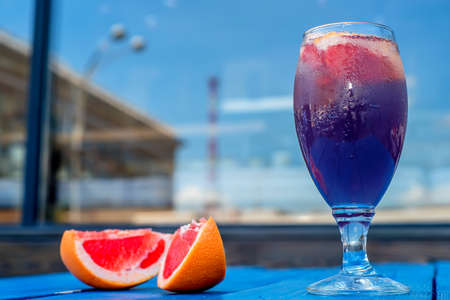 Dark restaurant cocktail with grapefruitの写真素材