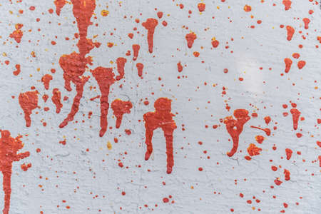 Closeup texture white wall with red paint streaksの写真素材