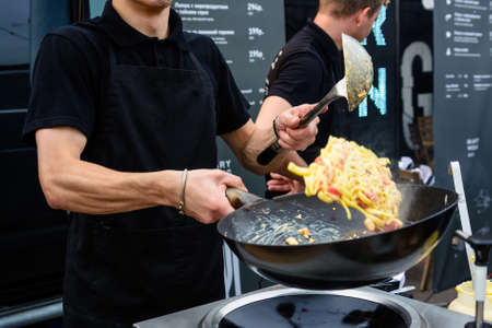 Close up making pasta with wokの写真素材