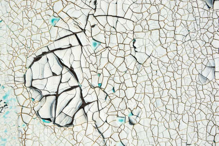 Close up white cracked paint on wallの写真素材