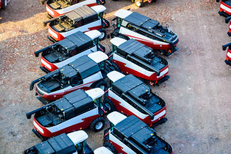 Rows of new grain harvesters on factoryの写真素材