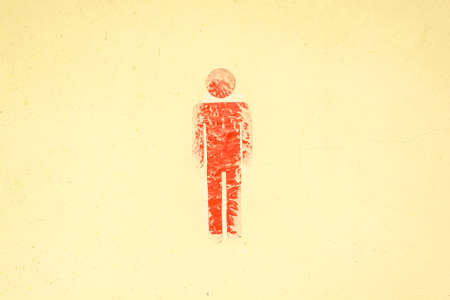 Old dirty toilet sign on wall male figureの写真素材