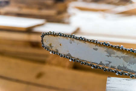Close up chainsaw in carpenters worshopの写真素材