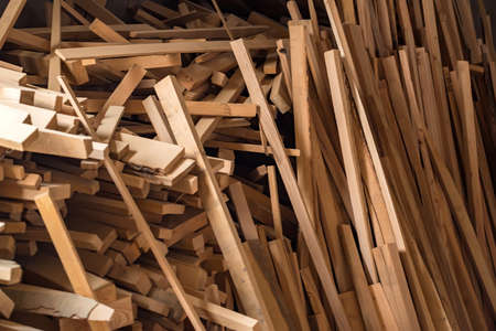 Many wooden beams stored at carpenters