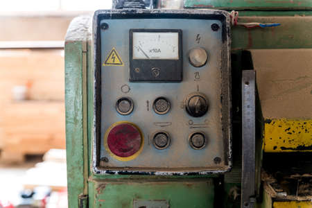 Close up old control board in carpenters