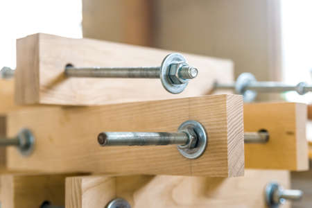 Wooden beams connected with metal screwsの写真素材