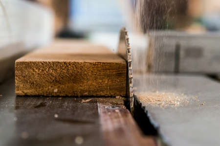 Circular saw cuts wood close upの写真素材