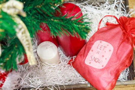 Christmas decoratios colorful candles and red bagの写真素材