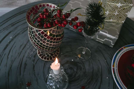 Christmas decoration with candle,vase and presentsの写真素材