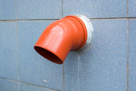 Old industrial pipe in wallの写真素材