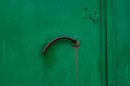 Close up old green metal door with handleの写真素材