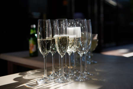 Several champagne glasses on tableの写真素材