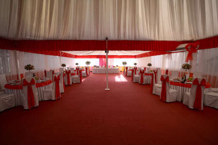 Served tables in restaurant for wedding receptionの写真素材