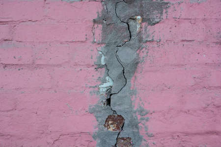 Abstract texture of wall with a big crack in cementの写真素材