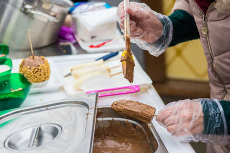 Making chocolate dipped bananas
