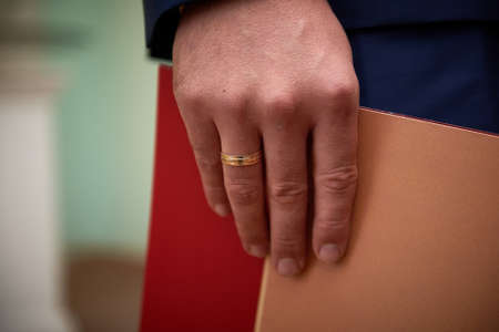 Close up of grooms handの写真素材