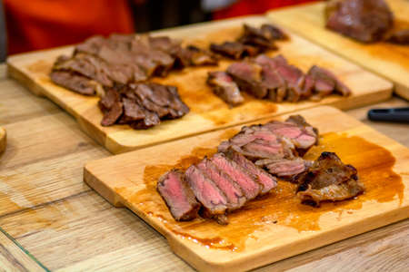 Close up sliced steak on cutting board