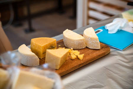 Various types of cheese on cutting boardの写真素材