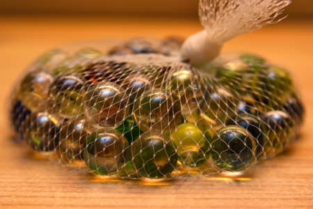 Colorful glass marbles in net