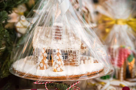 Gift-wrapped gingerbread house closeの写真素材