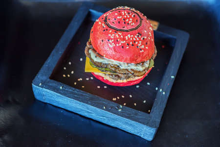 Red burger on a wooden boardの写真素材
