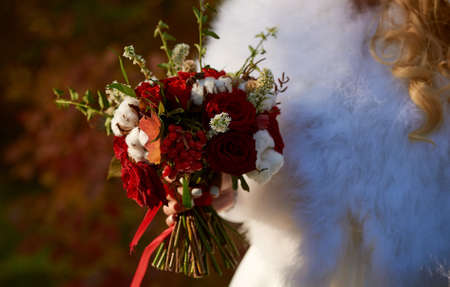 Beautiful bride holds wedding bouquetの写真素材