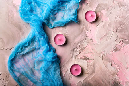 Romantic background with candles and shawlの写真素材