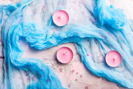 Romantic background with candles and shawlの写真素材