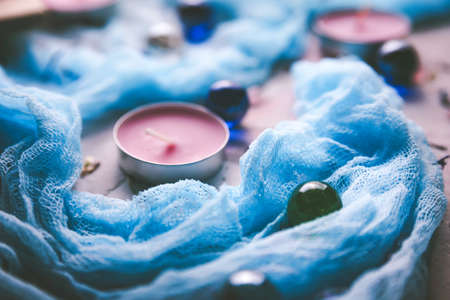 Romantic background with candles and shawl