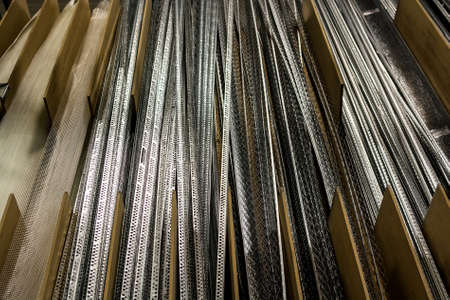 Close up many perforated corner beads for abstract backgroundの写真素材