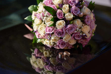 Wedding rings and brides bouquetの写真素材