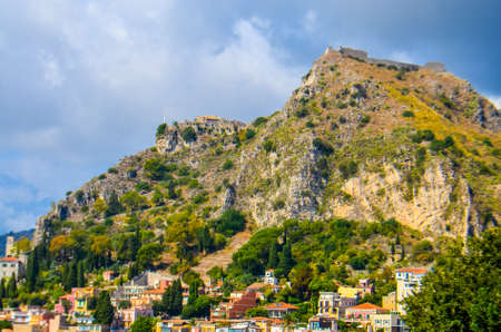 Sicilian lanscape with mountains and buildingsの写真素材