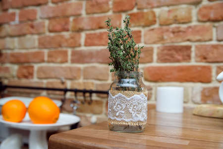 Rosemary branches in vase in kitchen