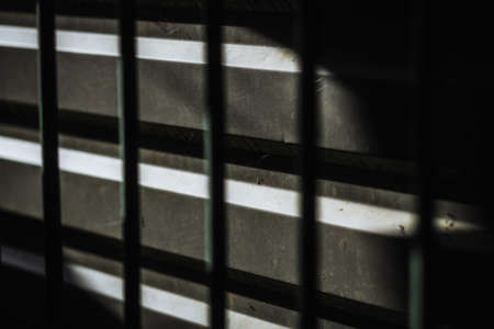 Dark abstract background with metal bar shadowの写真素材