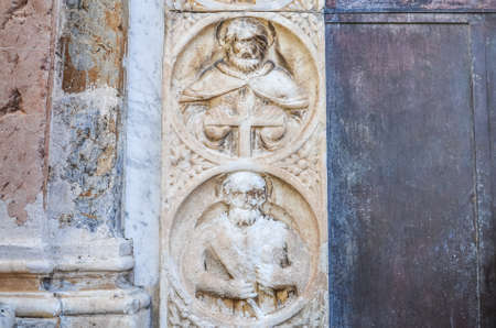 Religious stone carving on walls in Sicily, Italyの写真素材