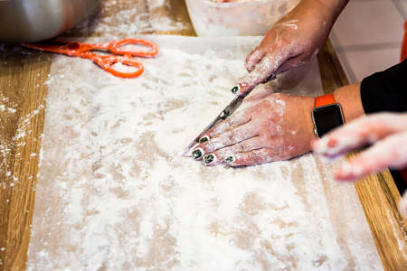 Woman hands cut white marshmallow