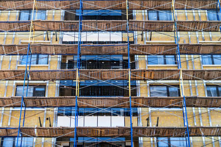 Construction site of building with scaffoldingsの写真素材