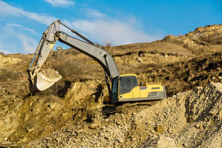Excavator works on construction siteの写真素材