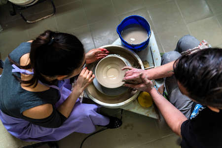 Working on potters wheel close