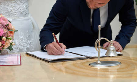 Groom and bride register marriage close upの写真素材