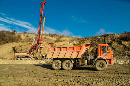 Road works with auger in the country in fallの写真素材