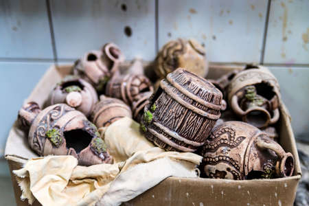 Various clay items in box. Pottery workshop