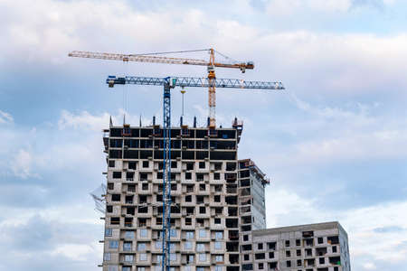 Modern construction site of building with craneの写真素材