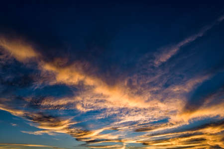 Dramatic blue sunset sky with pink clouds