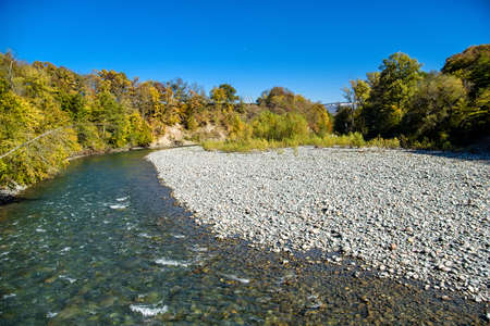 Landscape with mountain river and forest in autumnの写真素材