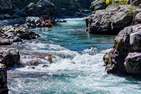 Landscape with mountain river and forest in autumnの写真素材